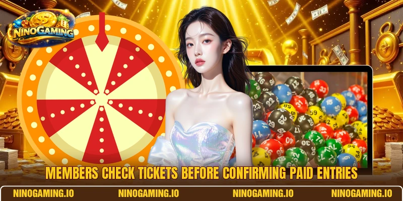 Members check tickets before confirming paid entries