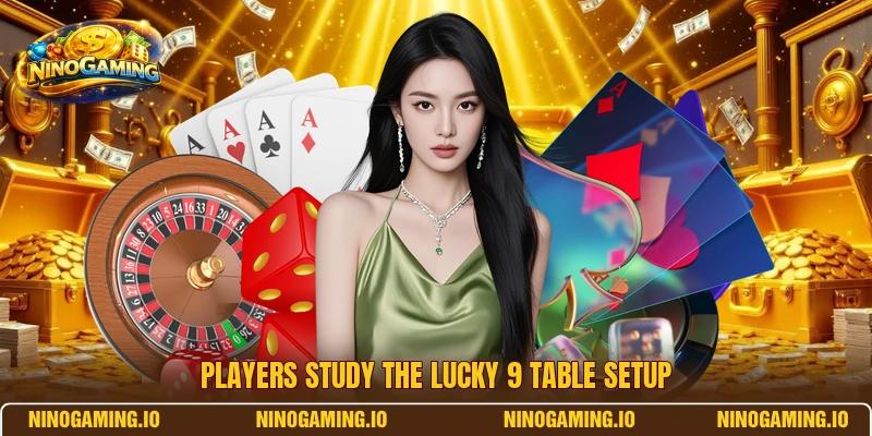 Players study the Lucky 9 table setup